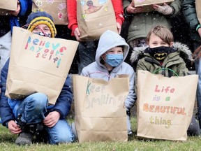 Grades 2-3 classmates Emery Daou, left, Cameron Desjardin and Spencer Knoblauch were among the students from Georges P. Vanier Catholic School giving 40 Easter gift bags to Maple City Retirement Residence and NeighbourLink Chatham-Kent in Chatham, Ont., on Thursday, April 1, 2021. (Mark Malone/Chatham Daily News/Postmedia Network)