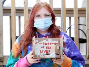 Grade 11 student Madison Kozlof of Ursuline College Chatham shows the artwork she created for a class assignment on the student experience during the COVID-19 pandemic. Photo taken in Merlin, Ont., on Saturday, April 3, 2021. Mark Malone/Chatham Daily News/Postmedia Network