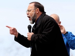 Pastor Henry Hildebrandt of Aylmer's Church of God speaks at an anti-lockdown protest at Tecumseh Park in Chatham, Ont., on Monday, April 26, 2021. Mark Malone/Chatham Daily News/Postmedia Network