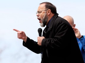 Pastor Henry Hildebrandt of Aylmer's Church of God speaks at an anti-lockdown protest at Tecumseh Park in Chatham, Ont., on Monday, April 26, 2021. Mark Malone/Chatham Daily News/Postmedia Network