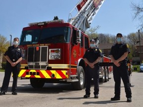 Owen Sound Fire Department members with the city's new Sutphen 100-foot mid-mount aerial platform truck, known as Ladder 3, at the fire hall on Saturday, April 24, 2021. From left are Capt. Ken Lawrence, Firefighter/Mechanic Brad Thede, and Firefighter Kyle Bowers. In the bucket are Firefighter Jeff MacMillan and Acting Capt. Brian Bridges.
