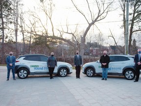Several members of Owen Sound city council stand with the two new electric vehicles that have been added to the city's vehicle fleet. From left to right are: Councillors Travis Dodd and Marion Koepke, Mayor Ian Boddy, Coun. Richard Thomas and Deputy-mayor Brian O'Leary. SUBMITTED