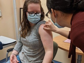 A clinical trial participant gets injected with Entos Pharmaceuticals' Covigenix VAX-001 vaccine at the Canadian Center for Vaccinology in Halifax, N.S. SUPPLIED