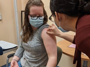A clinical trial participant gets injected with Entos Pharmaceuticals' Covigenix VAX-001 vaccine at the Canadian Center for Vaccinology in Halifax, N.S. SUPPLIED