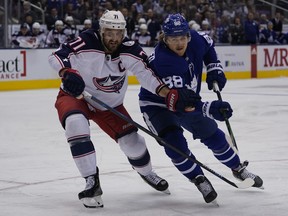 New Maple Leafs forward Nick Foligno battles with now teammate William Nylander when Foligno played for Columbus.