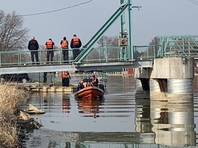 Chatham-Kent fire rescue and Chatham-Kent police officers search Wednesday morning for a man who jumped into the Sydenham River in Wallaceburg while running away from police Tuesday night. A body was found just before noon Wednesday. Photo taken Wednesday, April 7, 2021. (Ellwood Shreve/Chatham Daily News)