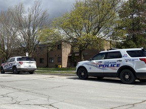 Kingston Police cruisers outside 123 Van Order Dr. on Tuesday, April 20, 2021.