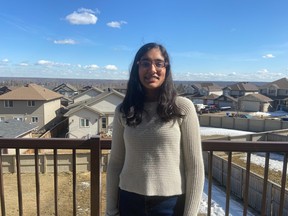 Aarushi Vasal stands on her balcony in Fort McMurray. Image supplied by Raj Vasal