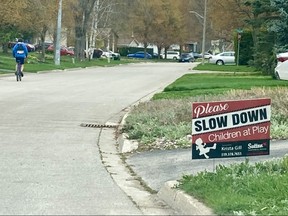 A lawn sign on 6th Avenue West in Owen Sound asks drivers to slow down. City staff is recommending several blocks of the street serve as a pilot location for traffic-calming measures due to concerns about drivers travelling at excessive speeds. DENIS LANGLOIS