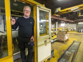 Paul Smith, president of Arva Industries in St. Thomas, stands on a maintenance rail car the company is building for a transit company. The maintenance cars are used by transit companies to keep their lines in proper order. Arva Industries has landed a contract to build maintenance rail cars for the New York City transit system. (Mike Hensen/The London Free Press)