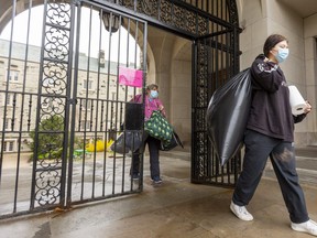 Michaela Hopley, 18, and her mom Rosanna Gaudio leave Western University's Medway Hall as they move Michaela out on Monday and head home to Newmarket. London’s three New Democrat MPPs urged the province Monday to declare the N6A postal code area a provincial COVID-19 hot spot. (Mike Hensen/The London Free Press)