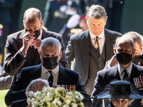 Members of the Royal Family follow the coffin of Britain's Prince Philip, husband of Queen Elizabeth, who died at the age of 99, as they enter at Saint George's Chapel for his funeral service, in Windsor.