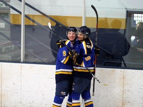 Fort McMurray Oil Barons forwards Hunter Lamb and Hassan Akl celebrate a goal against the Grande Prairie Storm at Centerfire Place. Photo by Dan Lines