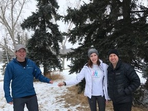 Tim Leach of The Streets Initiative presents a cheque to Risky Genes cancer society. Leach is donating a dollar for every kilometer he runs. Photo supplied.