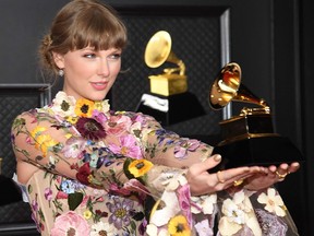 In this handout photo courtesy of The Recording Academy, Taylor Swift poses in the media room during the 63rd Annual GRAMMY Awards at Los Angeles Convention Center on March 14, 2021 in Los Angeles.