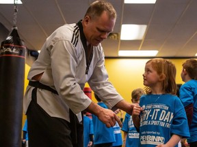 Champions Gym owner Raphael Bergmann helps a participant during a Try-It-Day event in January of 2020. The online version of Try-It-Day starts on April 10 at 9 a.m., numerous sporting organizations across the region participating in the event. The cost is free and anyone can participate.