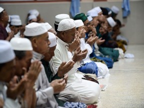 Muslim devotees offer special Taraweeh prayer in a mosque during the holy month of Ramadan in Narathiwat, Thailand on May 20, 2019.