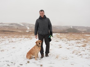 Bad weather doesn't stop Quinn Beck from enjoying the outdoors as he takes his dog Penny for a walk at Nose Hill Park in Calgary. Chair of the Airdrie Committee, Beck was named Ducks Unlimited Canada's Volunteer of the Year in Alberta. Photo by Riley Cassidy