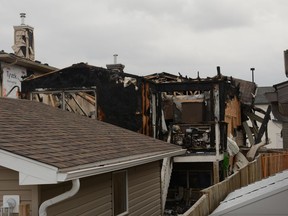 A rear view of the home that caught fire on April 16 shows the extent of the devastation caused. Photo by Riley Cassidy