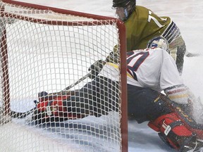 Wellington Dukes netminder Ethan Morrow slams the door on Trenton Golden Hawk Ryan Glazer in the second period of Game 8 of an exhibition series between the OJHL rivals. Although the puck did eventually enter the net on the play, it was waved off as the referee's ruled Morrow had been pushed into the net, which became dislodged. Wellington skated to a tight 1-0 win. BRUCE BELL