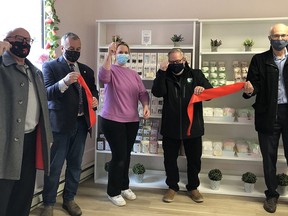 Miranda Odorico cuts the ribbon to officially open her new specialty bakery Sweet Retreats at 375 Front St. in Belleville's Downtown District with the help of city councillors Bill Sandison and Chris Malette, Bay of Quinte MP Neil Ellis, and MPP Todd Smith's executive assistant David Joyce. SUBMITTED PHOTO