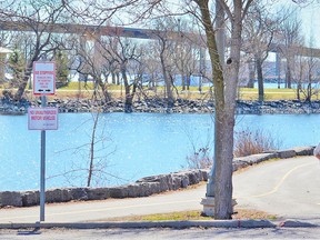 While advised to stay at home and travel only for essential trips for the next month under a provincial state of emergency order effective Thursday, residents are encouraged to visit city parks and trails to maintain physical exercise. Residents walked the waterfront trail overlooking West Zwicks Park Thursday to take in glorious sunny, warm spring weather.  DEREK BALDWIN