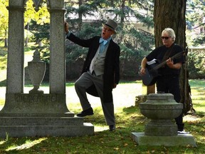 Don Roberts entertains in song, accompanied by guitarist Ken Hudson,  during a costumed walking tour in Picton's Glenwood Cemetery circa 2012. Peg DeWitt photo