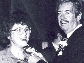 Former Intelligencer photographer Alicia "Kenny" Chambers is honoured at her retirement send-off in 1988 by former publisher Myles Morton. POSTMEDIA