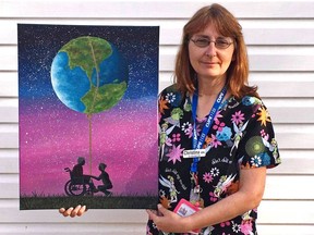 Registered practical nurse Christina Lasher holds her painting, "I will bring the world to you," which she created this month. It represents a health care worker and a long-term care resident.