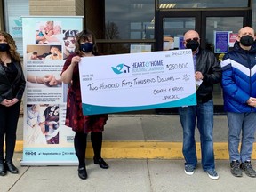 Hospice Quinte Donor Relations & Communications Manager, Sandi Ramsay, Hospice Quinte Executive Director, Jennifer May-Anderson receive a cheque from Benn and Zachary Spiegel (son and grandson of Sidney and Naomi Spiegel) for $250,000 in support of the Hospice Quinte Care Centre. SUBMITTED PHOTO