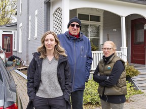 Mia Vamos-Yuhasz (left) and her parents Bob Yuhasz and Joanne Vamos were without power and internet for six hours on Thursday April 15, 2021 after a truck brought down a Bell fibre optic cable, causing about $1,000 damage to their Richmond Street home in Brantford, Ontario.