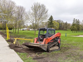 Work began Thursday to remove perimeter fencing around a portion of the former Arrowdale Golf Course along Rawdon and Elgin Streets in Brantford, to allow public access to the future community park. Four golf bunkers will be filled in, and some trees deemed dangerous to the public will be removed. Fencing remains in place in certain areas, including a portion under contract to be sold to a developer, pending litigation over the sale of the property. Brian Thompson/Brantford Expositor/Postmedia Network