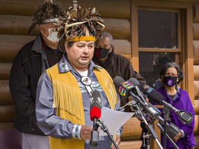 Chief Roger Silversmith of the Cayuga Nation reads a statement on behalf of the Haudenosaunee Confederacy Chiefs Council on Tuesday April 20, 2021 outside the Onondaga Longhouse on Six Nations of the Grand River Territory near Brantford, Ontario. The chiefs council has declared a moratorium on development on the Haldimand Tract, six miles on either side of the Grand River from mouth to source, a distance of 186 miles.