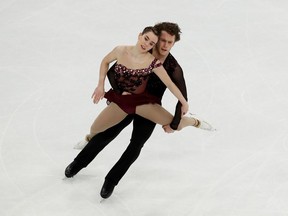 Evelyn Walsh and Trennt Michaud, who train at the Wayne Gretzky Sports Centre, compete in pairs free skating during ISU World Figure Skating Championships last month in Stockholm.