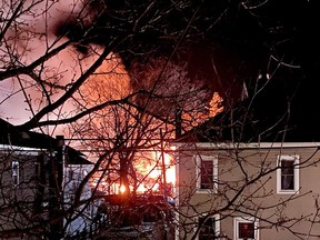 Woken by the flames, Melissa Rainville snapped this photo from her bedroom window on Saturday April 3 at 1:26 a.m.. The fire completely destroyed her brand new business, Trinkets Boutique, and left nine tenants homeless. (SUBMITTED PHOTO)