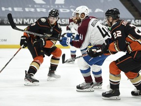 From left: Prescott-area native Ben Hutton stops the puck on a pass by Colorado Avalanche winger Pierre-Edouard Bellemare with Anaheim defenceman Kevin Shattenkirk on his tail during the Ducks' 4-1 home loss on Sunday. It would be Hutton's final game with Anaheim; he was traded to the Toronto Maple Leafs on Monday.
Kelvin Kuo-USA TODAY Sports