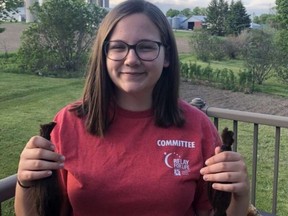 TISS Relay at Home participant Hillary Eyre holds her hair to be donated in June 2020. The Brockville high school is taking part in the 2021 virtual edition of Relay for Life in late May to raise money for the Canadian Cancer Society.
File photo/Submitted/The Recorder and Times