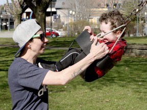 PLAYGROUNDS ARE OPEN
Sarah Birrell prepares to give her one-year-old son Lucas a push on the swings at Hardy Park on Monday afternoon. Play structures are now open again, but subject to strict COVID-19 precautions for being outdoors. (RONALD ZAJAC/The Recorder and Times)