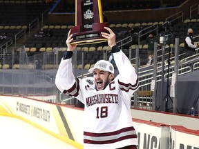 Former Kemptville 73's centre Jake Gaudet celebrates after
the UMass Minutemen win the NCAA Frozen Four men's hockey championship in Pittsburgh earlier this month. Gaudet played his first game with the AHL's Cleveland Monsters on Tuesday night.
Gregory Shamus/Getty Images