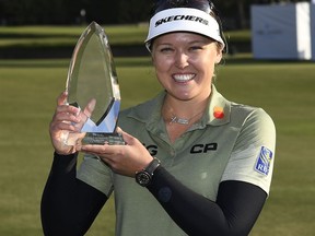 Smiths Falls native Brooke Henderson holds the trophy after winning the HUGEL-AIR PREMIA LA Open on Saturday.
Kevork Djansezian/Getty Images