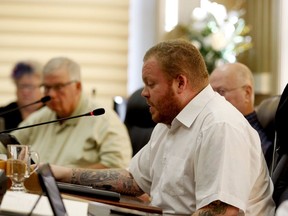 Brockville Coun. Leigh Bursey speaks, while Coun. Jeff Earle listens in the background, during a committee meeeting in 2019. (FILE PHOTO)