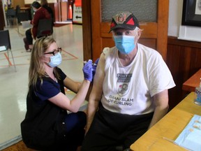 Highgate resident Francis Webb was among the more than 300 people who received a COVID-19 vaccination during a mobile vaccination clinic held at the Mary Webb Centre in Highgate on April 17. Webb received the shot from Krystina Kokhna, a registered practical nurse with the Chatham-Kent Health Alliance. Ellwood Shreve/Postmedia Network