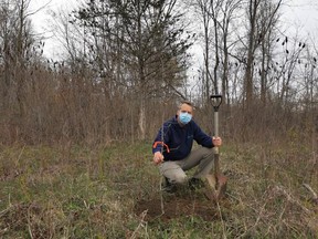 To commemorate Earth Day, Randall Van Wagner, Lower Thames Valley Conservation Authority's manager of conservation lands and services, plants a Black Oak sapling at a 25-acre property donated by East Kent resident Kenneth Ashton. (Handout/Postmedia Network)