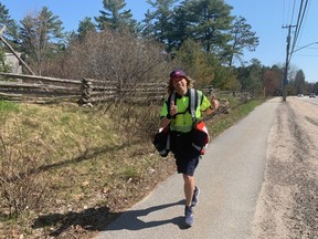 Derek Corbeil runs along Lakeshore Drive Saturday morning raising awareness for Canada Post employees and all front line workers during the COVID-19 pandemic. The Canada Post employee ran 20 kilometres from his home on Highway 654 to the North Bay waterfront.