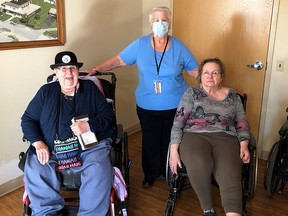 Deb Powers, middle, the 2021 Norm LaChapelle Award for Volunteerism recipient, is seen here with Riverview Gardens residents Pat Warwick, left, and Noreen Davidson.