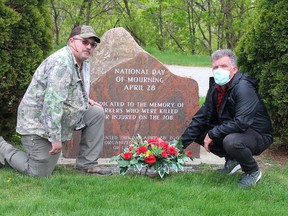 Chair of the local Unifor Labour Cabinet, Frank Niehus, left, and Unifor Local 127 president Jeff McFadden paid tribute the fallen and ill workers on the National Day of Mourning in Chatham on Wednesday. (Ellwood Shreve/Chatham Daily News)