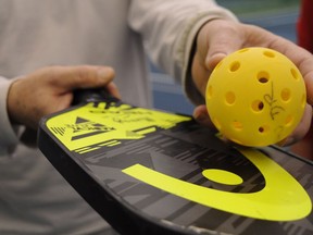 A pickleball paddle and Wiffle ball. File photo/Postmedia Network