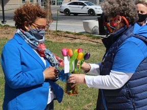 Virginia Lake (right) with a presentation of hand-made tulips to Cornwall Mayor Bernadette Clement. Photo on Monday, April 12, 2021, in Cornwall, Ont. Todd Hambleton/Cornwall Standard-Freeholder/Postmedia Network
