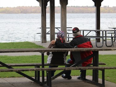 A couple enjoying a quiet afternoon at the Morrisburg waterfront. Photo on Saturday, April 24, 2021, in Morrisburg, Ont. Todd Hambleton/Cornwall Standard-Freeholder/Postmedia Network