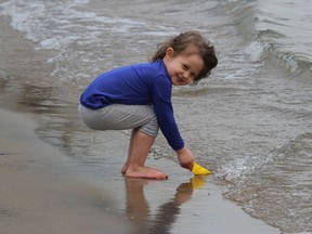 Brie Bush, 4, was having fun in the sand and water,  during a family visit on the weekend to the beach in Iroquois. Photo on Saturday, April 24, 2021, in Iroquois, Ont. Todd Hambleton/Cornwall Standard-Freeholder/Postmedia Network